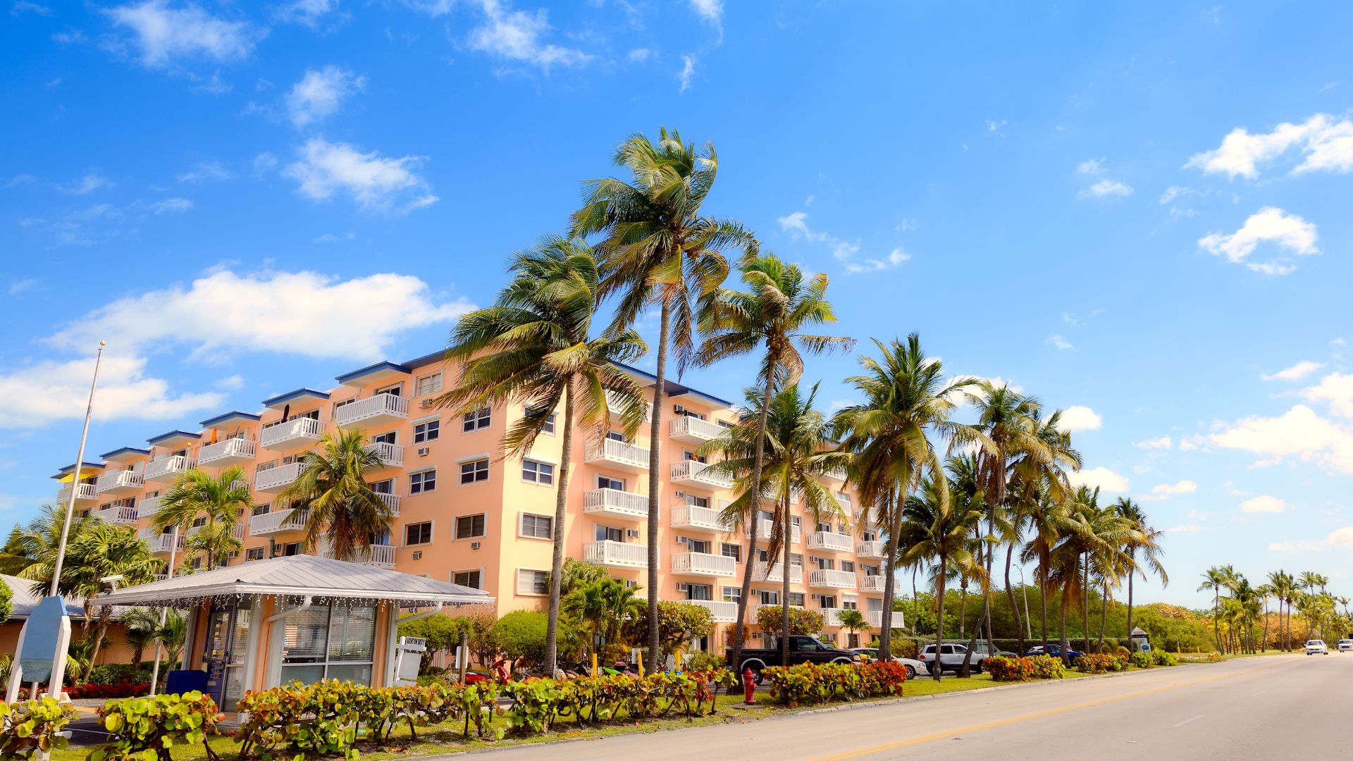 exterior of an apartment video in central florida surrounded by palm trees